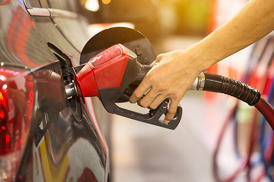 Person fills their car with gas.