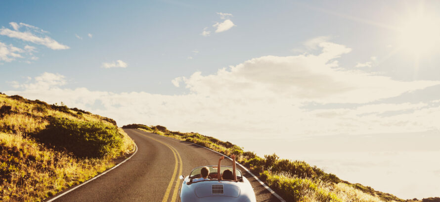 A convertible car on the road