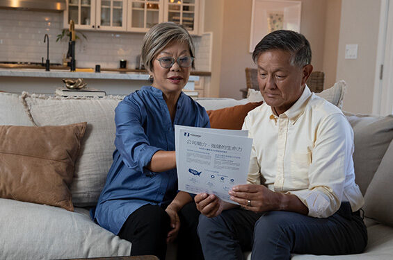 Two people looking at some papers together.