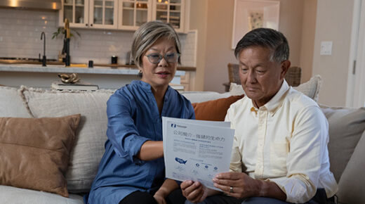Two people looking at some papers together.