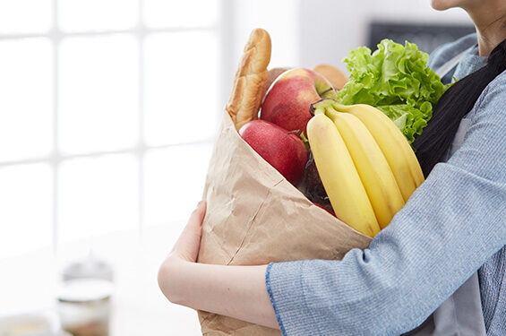 A person carrying a bag of groceries.