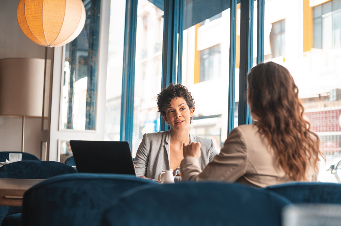 Two women in a meeting.