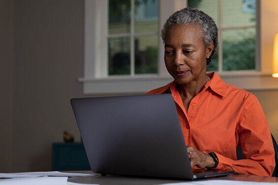 A woman using a laptop.