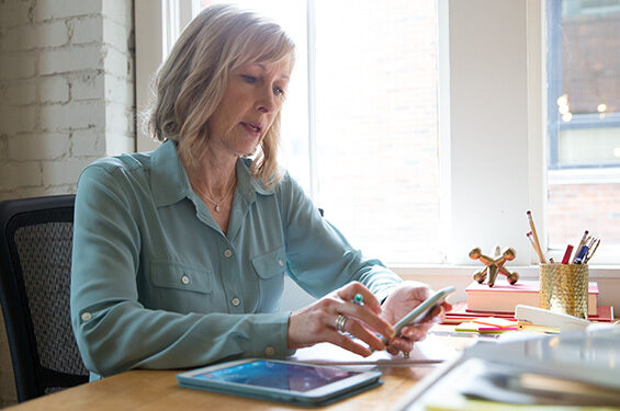 A woman using a mobile.