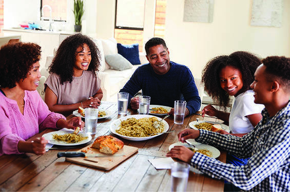 A blended family gathers at the table.
