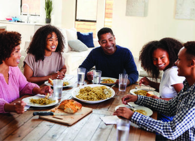 A blended family gathers at the table.